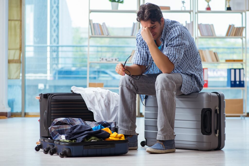 Man preparing for travel and seeing passport is stolen